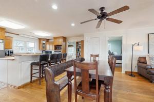 a kitchen and living room with a table and chairs at The Answer in Edisto Island