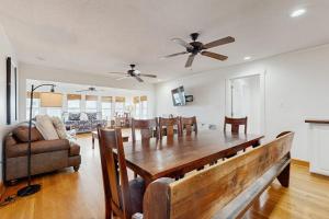 a dining room and living room with a table and chairs at The Answer in Edisto Island