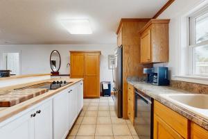 a kitchen with a sink and a counter top at The Answer in Edisto Island
