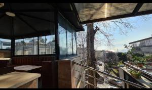 a building with a balcony with a view of a city at Buhara 93 House - Sultanahmet in Istanbul