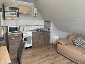 a living room with a couch and a kitchen at Nina in Bad Wildungen