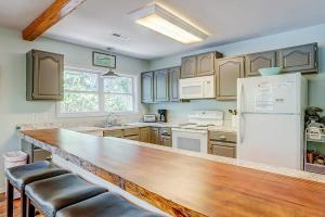 a kitchen with a wooden counter top and a refrigerator at In Spite of Ourselves in Edisto Beach