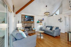 a living room with two couches and a fireplace at Artsea Phartsea in Edisto Beach