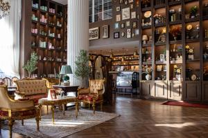 a room with chairs and tables in a room at The Classic Palace in Abha