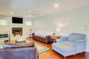 a living room with a couch and a chair at Goldie's Retreat in Edisto Beach