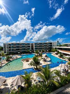a view of the pool at a resort at FLAT RESORT LUXO MALIA 215E- Porto de Galinhas - Muro Alto in Porto De Galinhas