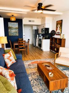 a living room with a couch and a table at Renovated Oceanfront 1BR by Skywheel Yachtsman 400 in Myrtle Beach