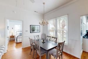 a dining room with a table and chairs at Myra's Cottage in Edisto Beach