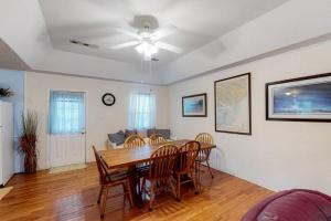 a dining room with a table and chairs at Sand Quarters in Edisto Beach