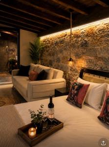 a living room with two beds and a couch at Sea La Vie in Keramídhion