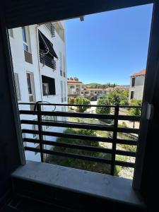 a view out a window of a balcony of a building at River apartment in Tushemisht