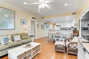 a living room with a couch and a table at The Retreat 7A in Edisto Beach