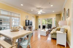 a living room with a table and a couch at The Retreat 7A in Edisto Beach