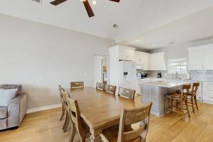 a kitchen and dining room with a table and chairs at A Shore Thing in Edisto Beach