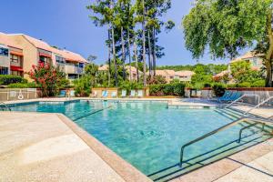 a large swimming pool in a building with trees at Anchorage 7444 in Hilton Head Island
