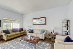 a living room with two couches and a table at Anchorage 7444 in Hilton Head Island