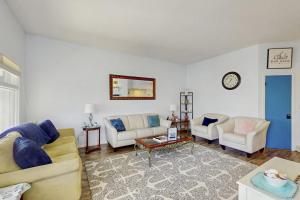 a living room with two couches and a table at Anchorage 7444 in Hilton Head Island