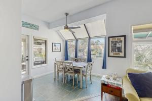 a dining room with a table and chairs at Anchorage 7444 in Hilton Head Island +18 photos