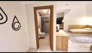a room with a bedroom with a bed and a mirror at Buhara 93 House - Sultanahmet in Istanbul