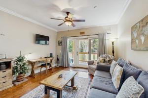 a living room with a couch and a table at The Tidey Turtle in Edisto Beach