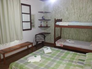 Postel nebo postele na pokoji v ubytování Itaúna Hostel