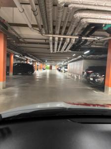 a parking garage with cars parked in it at Nordhaven Sundbyberg in Sundbyberg