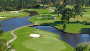 an aerial view of a golf course with a river at Pet-Friendly Luxury 3BR with Pool Sleeps 8 Near Beach in Myrtle Beach