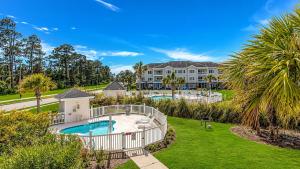 an aerial view of a villa with a swimming pool at Pet-Friendly Luxury 3BR with Pool Sleeps 8 Near Beach in Myrtle Beach