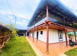 a building with a motorcycle parked in front of it at villa paraíso in Piura +4 photos