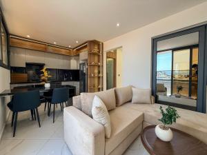 a living room with a couch and a table at LA VILLA Appart in Al Hoceïma