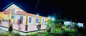 a house with lights on it at night at Samadi hotel and resort in Kekirawa