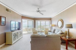 a living room with a couch and a television at Windsor Court North 4504 in Hilton Head Island