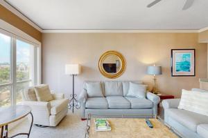 a living room with a couch and a chair at Windsor Court North 4504 in Hilton Head Island