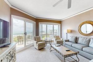 a living room with a couch and a table at Windsor Court North 4504 in Hilton Head Island +19 photos
