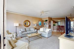 a living room with two couches and a table at Windsor Court North 4504 in Hilton Head Island