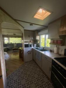 an open kitchen and living room of an rv at Hills View Accommadation in Borrisoleigh