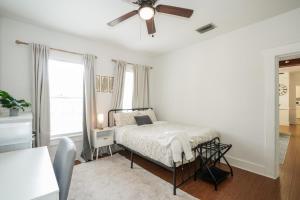 a bedroom with a bed and a ceiling fan at Updated 1 BR Home - Steps to 7th Ave in Tampa