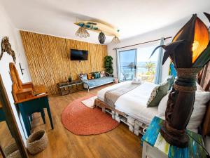 a bedroom with a bed and a large window at SeaViu Camps Bay in Cape Town +63 photos