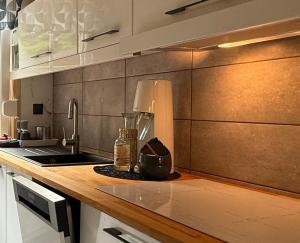 a kitchen with a sink and a counter top at Kamień na Kaszubach in Kamień +21 photos