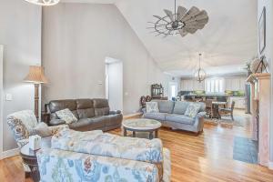 a living room with a couch and a table at Why Knot? in Edisto Island