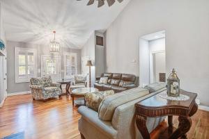a living room with a couch and a table at Why Knot? in Edisto Island