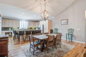 a kitchen and dining room with a table and chairs at Why Knot? in Edisto Island