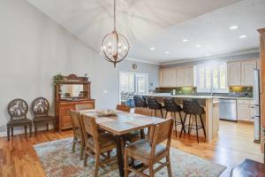 a kitchen with a table and chairs in a room at Why Knot? in Edisto Island