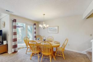a dining room with a table and chairs at Egrets Pointe 491 in Edisto Beach