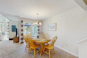 a dining room with a table and chairs at Egrets Pointe 491 in Edisto Beach +17 photos