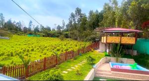 a house with a pool in front of a field at villa paraíso in Piura