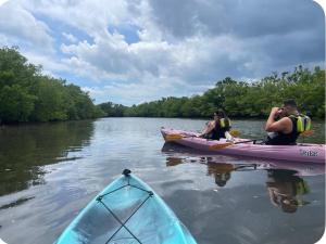 a group of people on a kayak on a river at Casa paz in North Miami Beach +2 photos