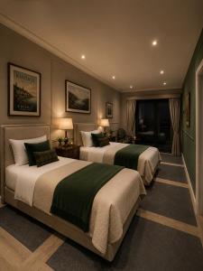 a bedroom with two beds and a window at Kinsale Suites in Nettuno
