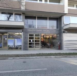 a store front of a building with the words biblioco cartico china at Departamento Centro Chillán in Chillán +4 photos
