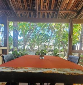 a table in a room with a large window at Bluehaven Austin House in La Paz